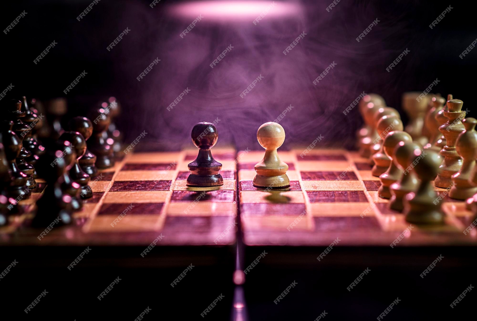 Premium Photo  Closeup of chess pieces on the chessboard under the lights  with a blurry background