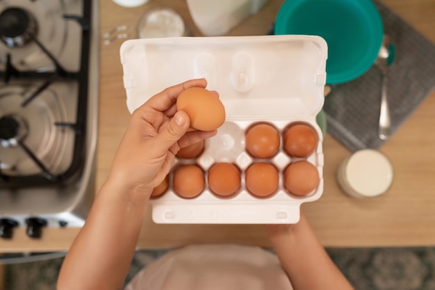 Closeup of chicken eggs in a tray in the kitchen