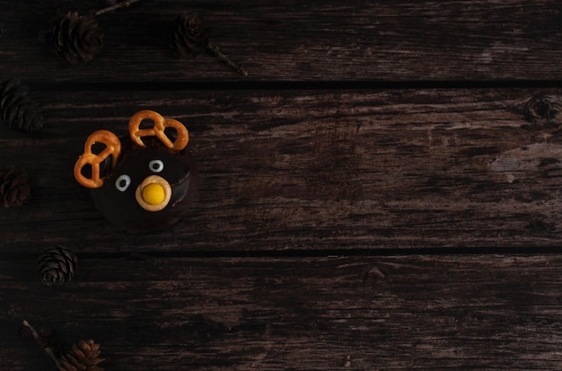 Closeup of a chocolate cake in the form of a deer on a dark background