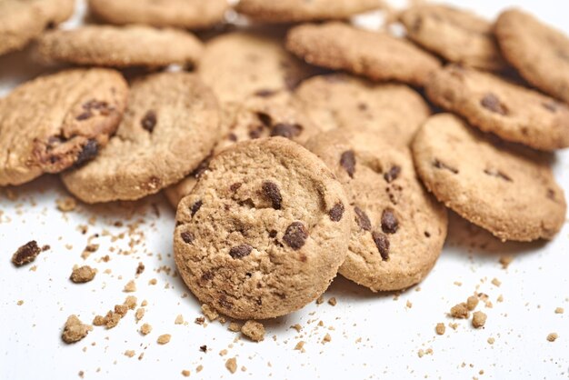 Closeup of chocolate chip cookies on a white surface good for breakfast related photos