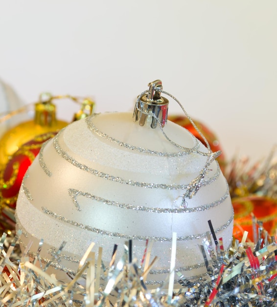 Closeup of a Christmas ball in silver color with other decorations