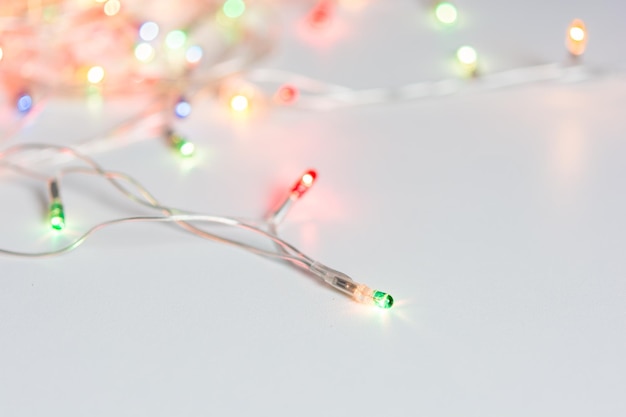 Closeup of christmas lights on white table