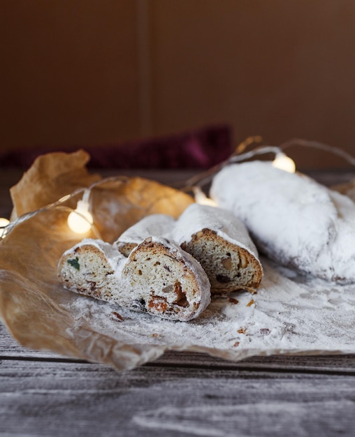 Closeup of a Christmas stollen sprinkled with powdered sugar