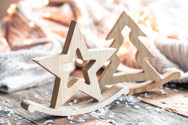 Closeup Christmas wooden decorative figurines on a blurred background