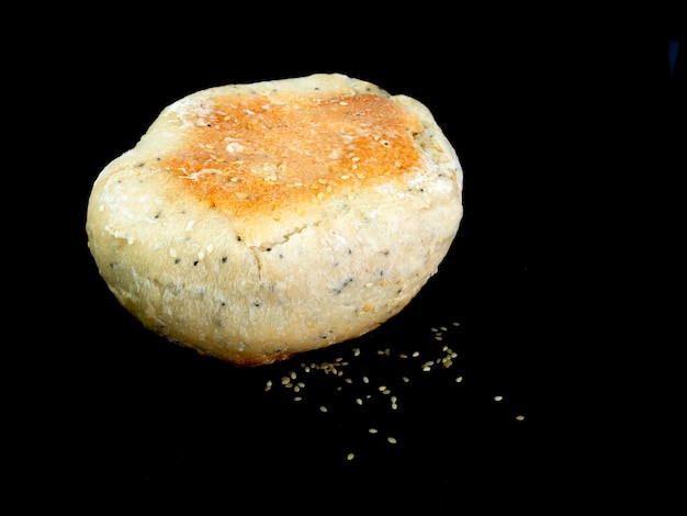 Closeup ciabatta bread on black background.