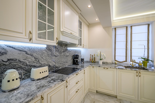 Closeup of classic creamcolored kitchen with appliances