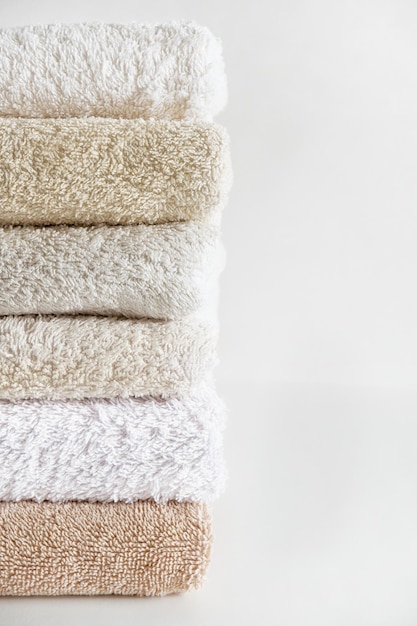 Photo closeup of clean cotton bath towels stacked the concept of cleanliness and freshness