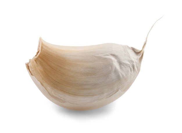 Closeup of clove of garlic over white background