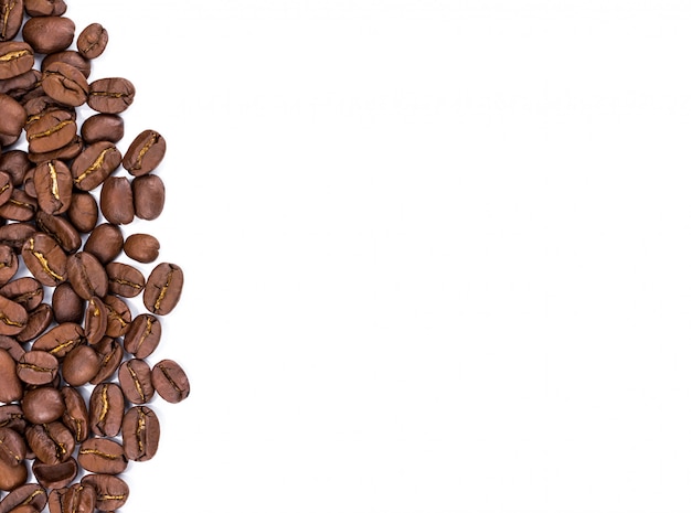 Closeup of coffee beans on white background. Copy space