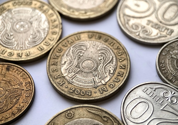 Closeup of coins of the republic of kazakhstan on a white background currency photography