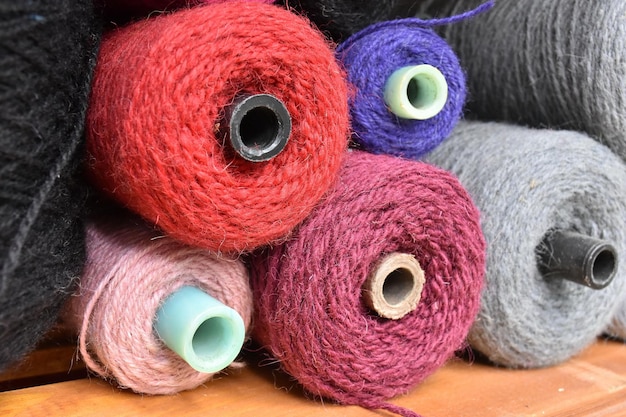 Closeup of colorful spools of thread sewing concept