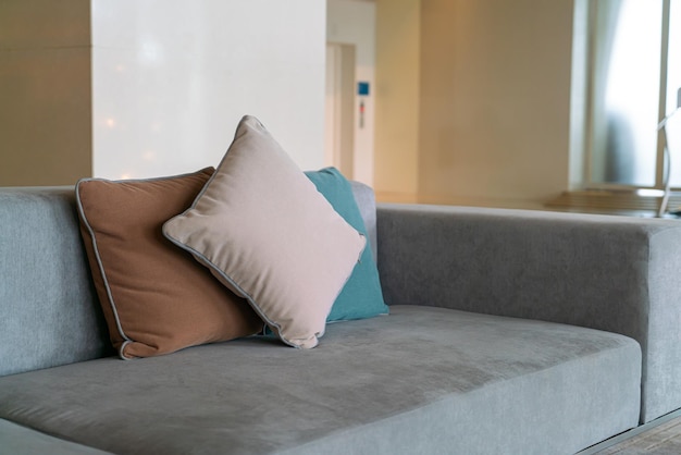 Closeup comfortable pillows on sofa