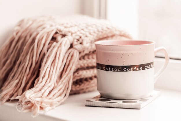 Photo closeup of composition on the windowsill pink mood.