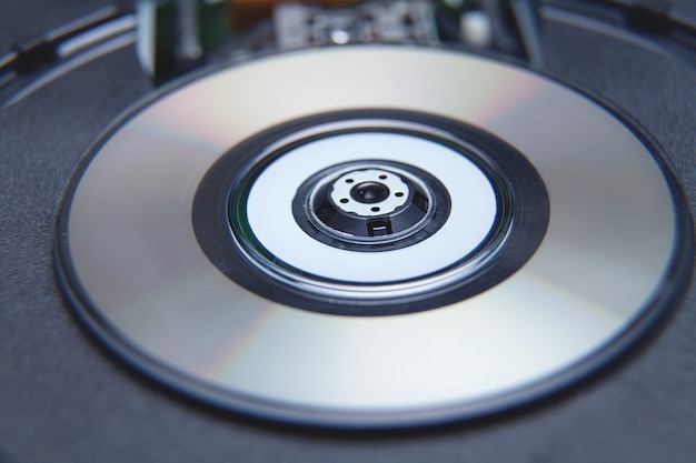 Closeup of computer DVD drive with a disk.