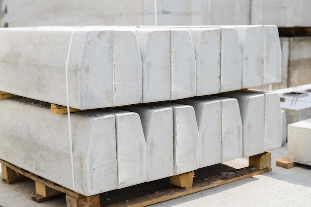 Closeup of concrete curbs in the warehouse of the precast concrete factory