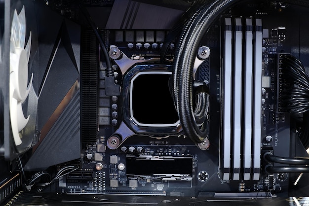 Closeup Cooling pump on CPU socket and quad channel RAM DDR4 that installed on modern mainboard