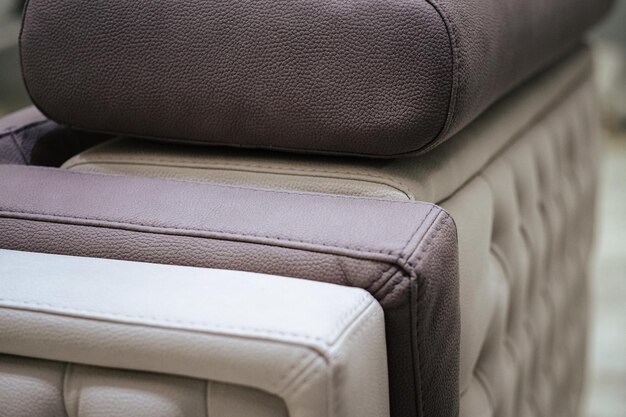 Photo closeup of cream and gray shaded leather furniture