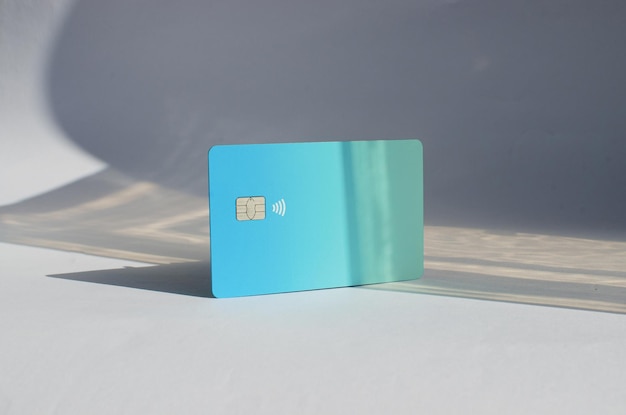 Closeup of a credit card with no apparent logo or brand representing the abstract concept of payment symbolizing the universe of financial transactions and electronic payments and purchases