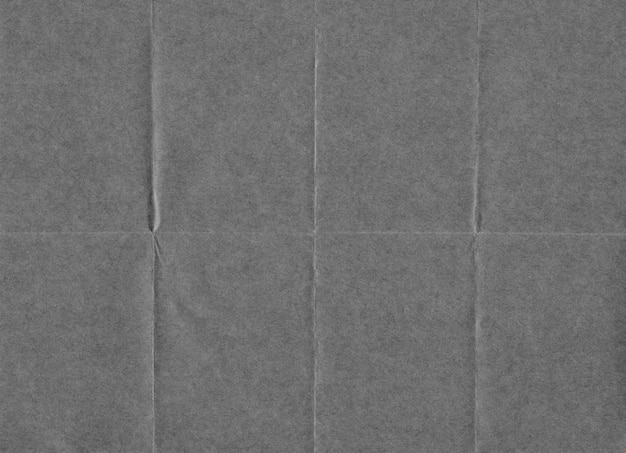 Photo closeup crumpled grunge grey paper texture background.