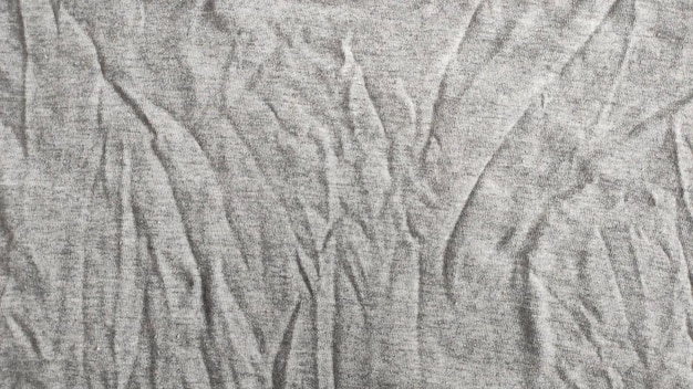 Closeup of crumpled heater and sportswear or hoodie with textured fabric background