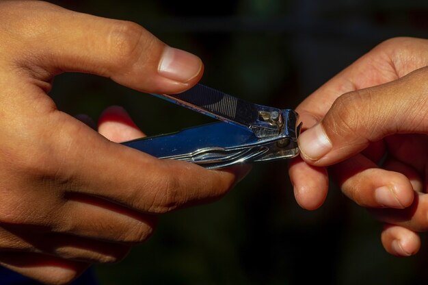 Closeup of cutting nails,  health care concept