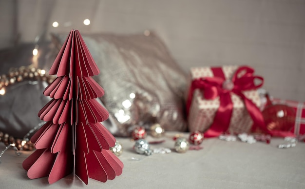 Closeup of a decorative cardboard Christmas tree on a blurred background