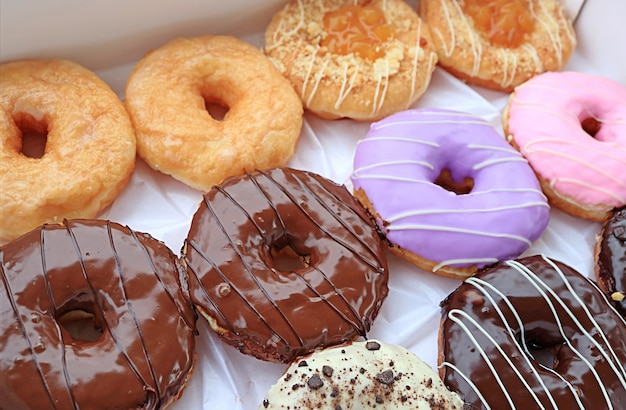 Closeup of delectable assorted doughnuts in a box