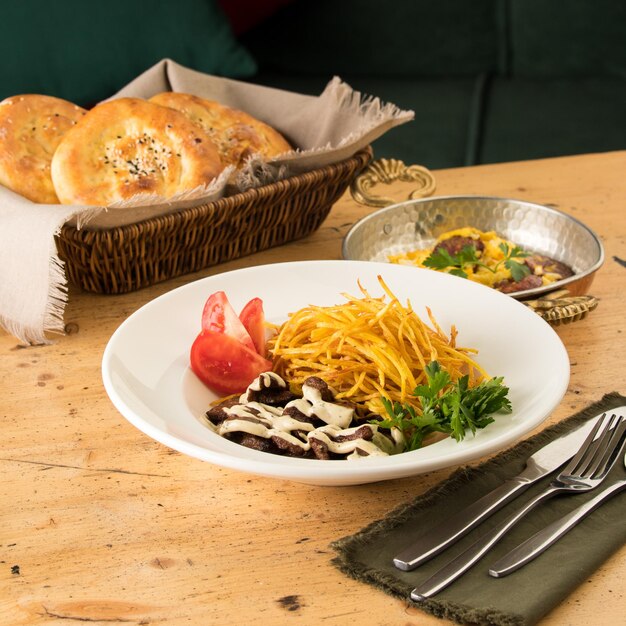 Closeup of a delicious dish with shredded potatoes beef sauce and sandwiches