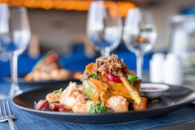 Closeup of delicious food served in plate on dining table at restaurant