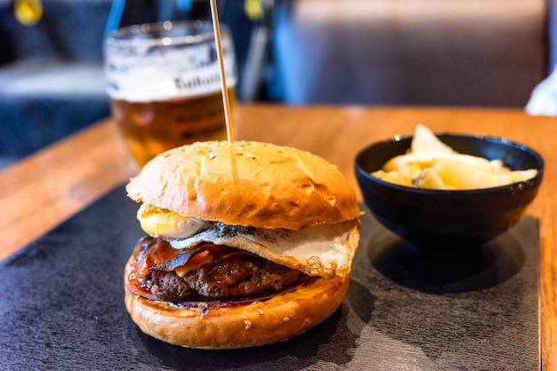 Closeup of delicious fresh hamburger on the table in restaurant