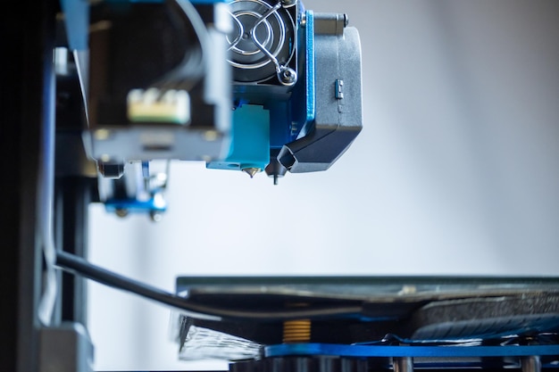 Photo closeup detail of the extruder of a 3d printer