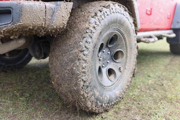 Closeup of dirty wheel of off road vehicle adventures and extreme travel concept