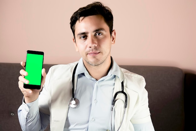 Closeup of doctor using phone at his office doctor working online