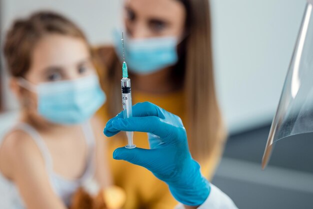 Closeup of doctor vaccinating a child at the hospital