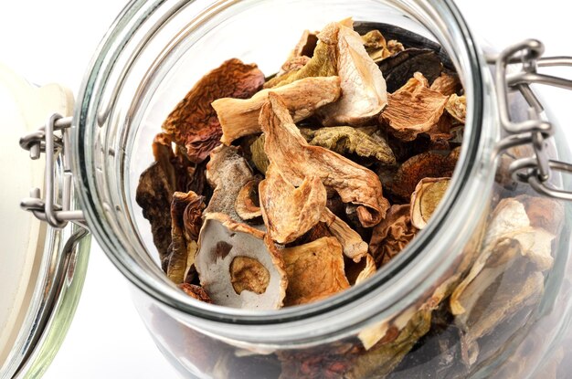 Closeup of dried homemade mushrooms in vintage glass jar
