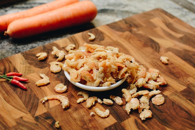 Closeup of Dried Shrimp on Wooden Board