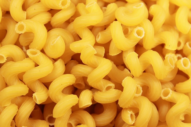 Closeup of dry uncooked cellentani pasta top view