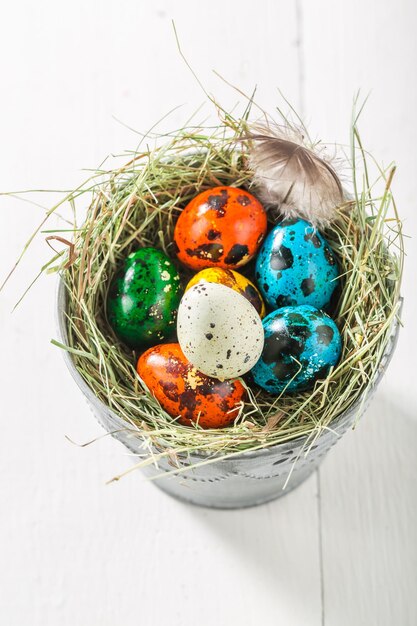 Closeup of ecological eggs for Easter on old white table