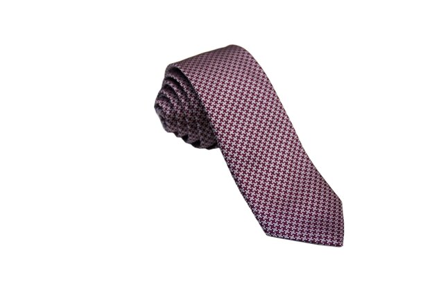 Closeup of an elegant stylish tie rolled and isolated on a white background