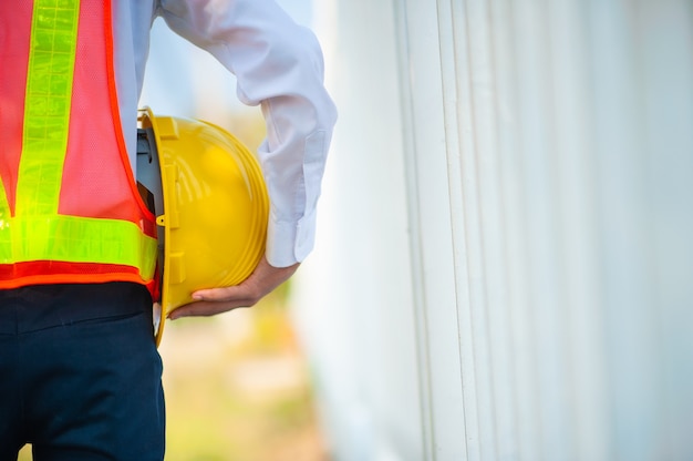 Closeup Engineer holding hardhat Engineering equipment