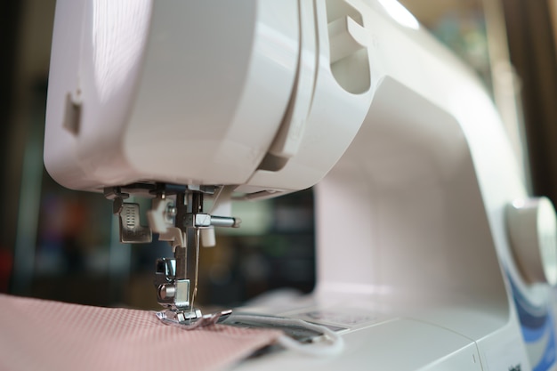 Closeup of fabrics and sewing machine for sewing.