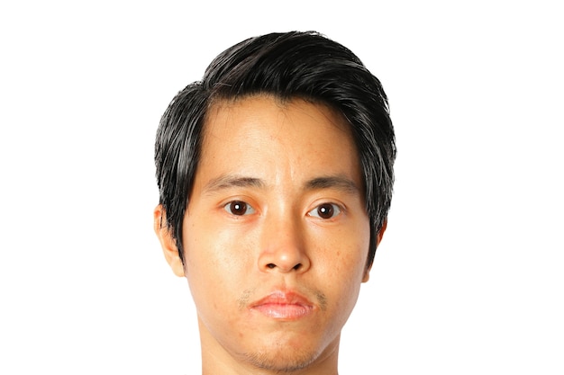 Closeup of face young Asian man on white background.