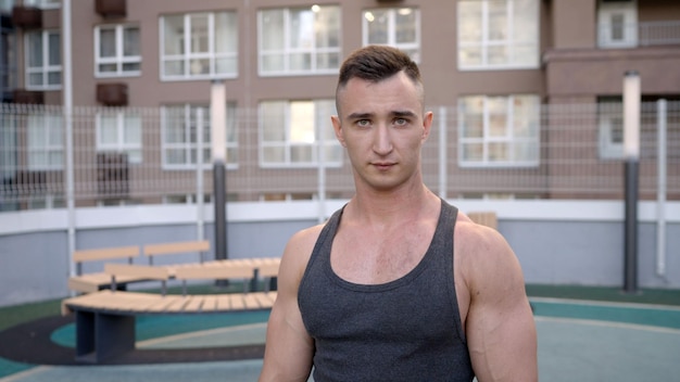 Photo closeup face of a young male athlete exhausted athlete after training strong athlete gaze