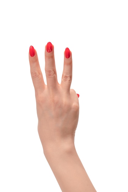 Closeup of female hand with pale skin and red nails pointing or touching isolated on a white background