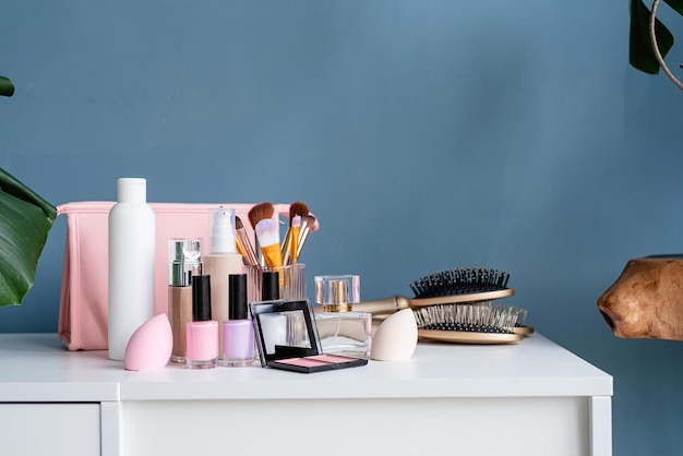 Closeup of feminine cosmetic products standing on dressing table