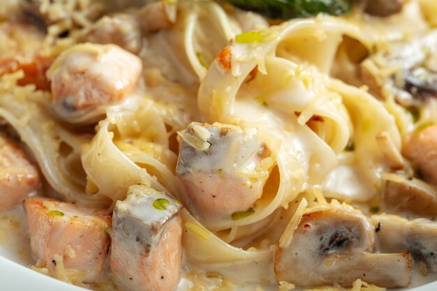 Closeup on fettuccine pasta with salmon