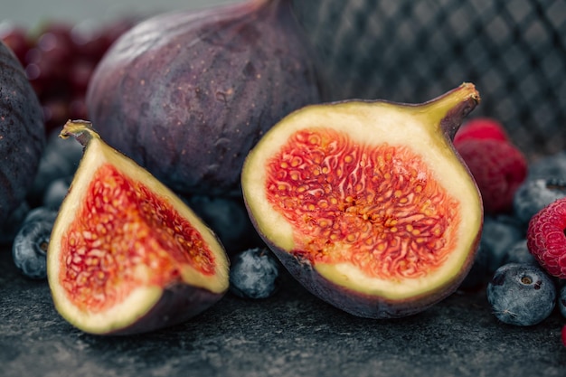 Closeup fig fruit on a blurred dark background