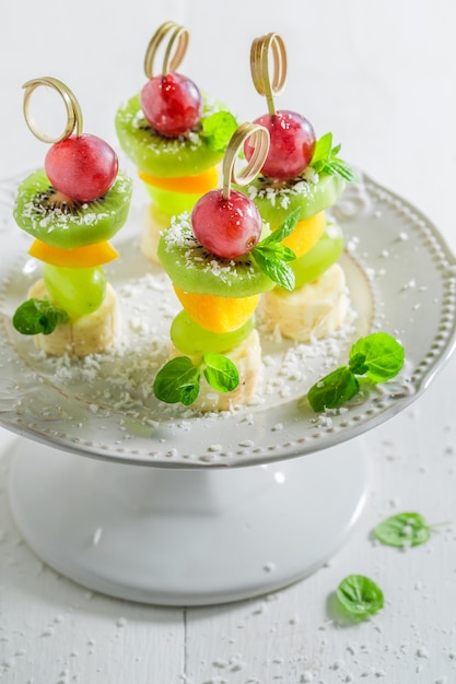 Closeup of finger food with fruits and mint for party