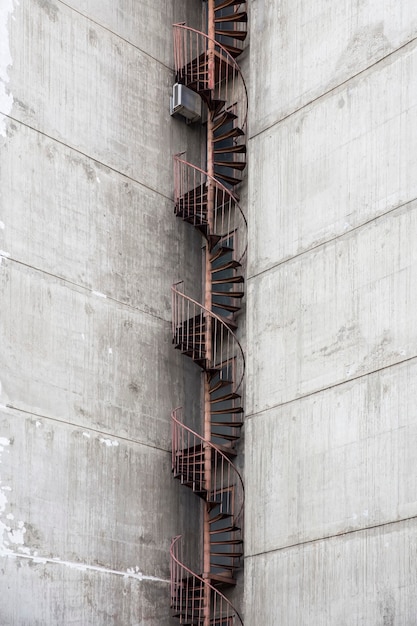 Photo closeup of the fire escape at concrete urban building