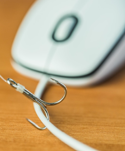 Premium Photo  Closeup of a fishing hook on computer mouse